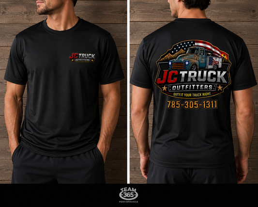 JC Truck Outfitters black Dri-Fit performance tee - left chest logo on the front, full truck badge and 785-305-1311 across the back