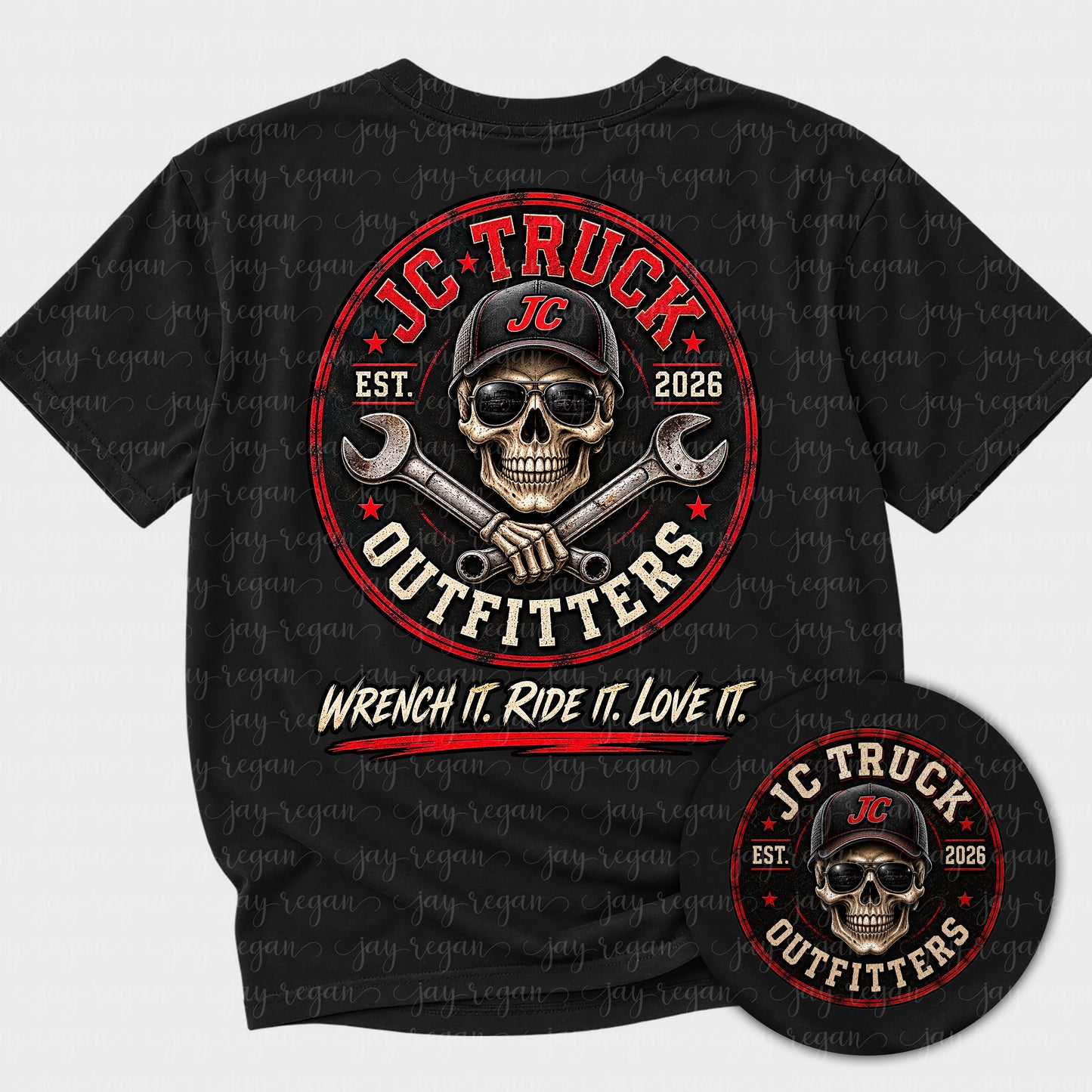 Black t-shirt with a full-back print: a circular worn badge with a skull in a JC cap and sunglasses over crossed wrenches, reading JC Truck Outfitters, Est. 2026, and Wrench it. Ride it. Love it.